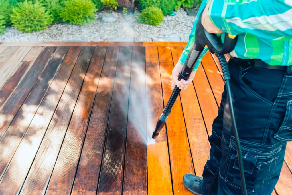 Pressure washing and deck sealing maintenance for homes in Flint, Michigan before freezing temperatures