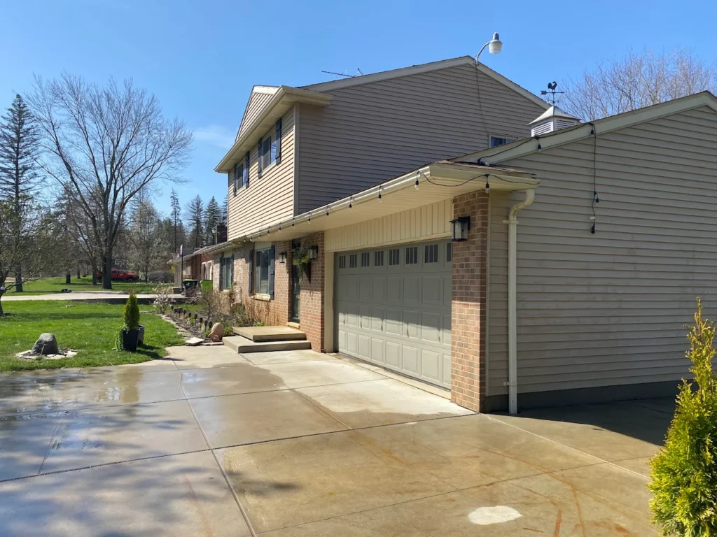 Exterior house cleaning and deck restoration service in Atlas, MI by Wipeout Pressure Washing & Staining