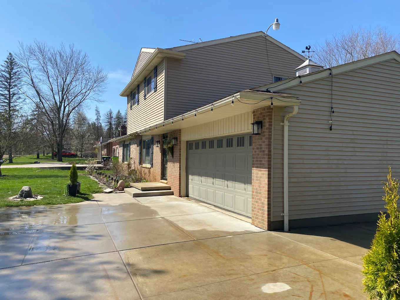 Exterior house cleaning and deck restoration service in Atlas, MI by Wipeout Pressure Washing & Staining